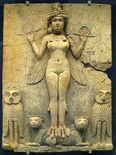 Bas relief stone sculpture of Ancient Sumerian Goddess of Fertility, Innana. Goddess is depicted naked holding metal objects in her hands and a headdress on her head.